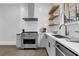 Contemporary kitchen with open shelves, stainless steel appliances, and modern finishes at 909 Sunny Meadows Lane, Marietta, GA 30062