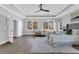 This main bedroom features hardwood floors, tray ceiling, and recessed lighting for a cozy and modern feel at 909 Sunny Meadows Lane, Marietta, GA 30062