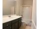 Bathroom features a single sink vanity and a shower and tub combination at 556 Paden Ridge Way, Lawrenceville, GA 30044