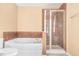 Bright bathroom featuring separate tub and glass enclosed shower at 6533 Waterford Sw St, Atlanta, GA 30331