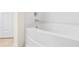 Clean white bathtub with chrome fixtures in a bright and neutral bathroom at 6533 Waterford Sw St, Atlanta, GA 30331