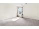 Bright bedroom with a window and light-colored walls and carpeting at 6533 Waterford Sw St, Atlanta, GA 30331