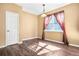 Bright dining area with large windows and wood-look flooring at 6533 Waterford Sw St, Atlanta, GA 30331