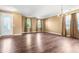 Bright living room with hardwood floors, front door, chandelier, and natural light at 6533 Waterford Sw St, Atlanta, GA 30331