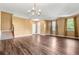 Inviting living room with chandelier, hardwood floors, and staircase at 6533 Waterford Sw St, Atlanta, GA 30331