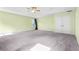 Large main bedroom with a ceiling fan, plush carpet, and double door closet at 6533 Waterford Sw St, Atlanta, GA 30331