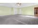 This main bedroom features carpet, ceiling fan, and double door closets with an en suite bathroom at 6533 Waterford Sw St, Atlanta, GA 30331