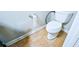 Bathroom featuring neutral tiling and a standard white toilet at 2238 Roseberry Ln, Grayson, GA 30017