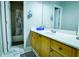 Bathroom featuring a wooden vanity with a white countertop, with a mirror, and shower and toilet rooms at 2238 Roseberry Ln, Grayson, GA 30017