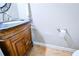 Bathroom with a vanity featuring granite countertops and a decorative cabinet at 2238 Roseberry Ln, Grayson, GA 30017