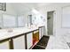 Bright bathroom with a dual sink vanity, marble floors, and a large mirror at 2238 Roseberry Ln, Grayson, GA 30017