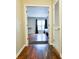 Bright bedroom showcasing wood floors, a ceiling fan, and natural light from a large window at 2238 Roseberry Ln, Grayson, GA 30017