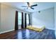 Sunlit bedroom featuring hardwood floors and neutral walls at 2238 Roseberry Ln, Grayson, GA 30017