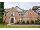 Beautiful brick house with detailed architecture and a well-maintained lawn, offering a glimpse of suburban living at 2238 Roseberry Ln, Grayson, GA 30017