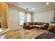 Cozy living space with hardwood floors, comfortable furniture, and natural light streaming through the windows at 2238 Roseberry Ln, Grayson, GA 30017