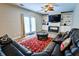 Comfortable living room featuring built-in shelving, a ceiling fan, and a plush leather sofa at 2238 Roseberry Ln, Grayson, GA 30017