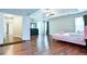Large main bedroom featuring wood floors, and ceiling fan, in a neutral color palette at 2238 Roseberry Ln, Grayson, GA 30017
