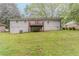A spacious backyard features a deck, a sturdy foundation, and lush green grass at 2682 Cavalier Dr, Decatur, GA 30034