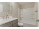The renovated bathroom features new hardware, a new sink vanity, a new countertop, and a bath and shower combo at 2682 Cavalier Dr, Decatur, GA 30034