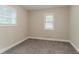 A simple bedroom with neutral paint, carpet floors, a window, and base trim at 2682 Cavalier Dr, Decatur, GA 30034