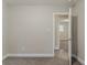 Neutrally painted bedroom with carpet flooring and a doorway leading to another room providing a versatile living space at 2682 Cavalier Dr, Decatur, GA 30034
