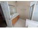 Bathroom featuring tile flooring, a white vanity, and a shower with glass doors at 3967 Moos Creek Ct, Loganville, GA 30052