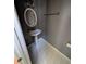 Cozy bathroom featuring an oval mirror, pedestal sink, and modern lighting fixtures against a gray wall at 3967 Moos Creek Ct, Loganville, GA 30052