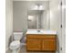 Bathroom featuring a single sink with bright wood cabinets, tile floors, and neutral colored walls at 7194 Oakwood Cir, Rex, GA 30273
