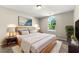Inviting bedroom with neutral tones, natural light and modern furnishings at 7194 Oakwood Cir, Rex, GA 30273