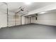 Spacious two-car garage with gray floors, white doors, and automatic door openers at 7194 Oakwood Cir, Rex, GA 30273