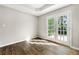 Bright room with French doors and hardwood floors at 7194 Oakwood Cir, Rex, GA 30273