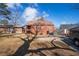 Back exterior of a brick house with a grassy yard and driveway at 958 Winburn Dr, Atlanta, GA 30344