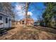 Back exterior of a brick house with a spacious grass backyard at 958 Winburn Dr, Atlanta, GA 30344
