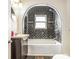 A modern bathroom showcases a unique tiled shower and tub combination at 958 Winburn Dr, Atlanta, GA 30344