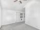 Carpeted bedroom features white walls, a ceiling fan and a closet at 958 Winburn Dr, Atlanta, GA 30344