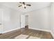 A bedroom with wood floors, neutral paint, and a ceiling fan at 958 Winburn Dr, Atlanta, GA 30344
