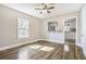 Sunlit living room showcases hardwood floors and an open view to the kitchen at 958 Winburn Dr, Atlanta, GA 30344