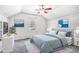 Cozy bedroom with a slanted ceiling, ceiling fan, and white wainscoting at 958 Winburn Dr, Atlanta, GA 30344