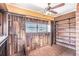 Sunroom featuring wood paneled walls and shelving with a brick floor at 958 Winburn Dr, Atlanta, GA 30344