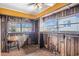 Bright sunroom with exposed wood accents, windows, and a brick floor at 958 Winburn Dr, Atlanta, GA 30344