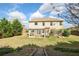 A spacious backyard, complete with a pergola-covered patio, garden beds and direct access to the upper yard at 415 Eldridge Dr, Suwanee, GA 30024