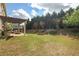 Large backyard featuring a pergola, patio and fire pit perfect for entertaining at 415 Eldridge Dr, Suwanee, GA 30024