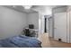 Minimalist bedroom with carpet, desk, closet, and neutral walls, offering a blank canvas for personalization at 415 Eldridge Dr, Suwanee, GA 30024
