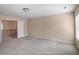 Large, neutral bonus room with carpet and an open doorway, providing a versatile space for various activities at 415 Eldridge Dr, Suwanee, GA 30024