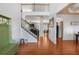 Elegant foyer with hardwood floors, staircase, and open view to other rooms, offering a grand entrance at 415 Eldridge Dr, Suwanee, GA 30024