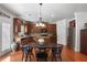 Well-equipped kitchen with stainless steel appliances, granite countertops, and an island at 415 Eldridge Dr, Suwanee, GA 30024