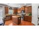 Stylish kitchen featuring stainless steel appliances, granite countertops, and functional island for meal prep at 415 Eldridge Dr, Suwanee, GA 30024