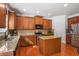 Bright kitchen boasting stainless steel appliances, granite countertops, and efficient island with storage at 415 Eldridge Dr, Suwanee, GA 30024