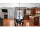 Open concept kitchen with stainless steel appliances, granite countertops, and seamless connection to living room at 415 Eldridge Dr, Suwanee, GA 30024