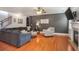 Cozy living room with fireplace, TV, and comfortable seating, ideal for relaxing and watching movies at 415 Eldridge Dr, Suwanee, GA 30024